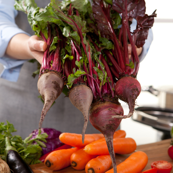 beets being held by a chef