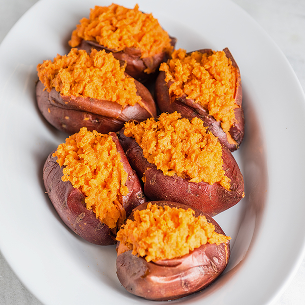 baked sweet potatoes in a white bowl
