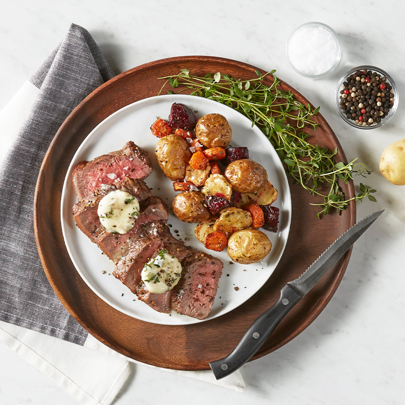 Air Fryer Steak and Winter Root Vegetables with Herb Compound Butter